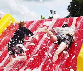 people climbing up a slide